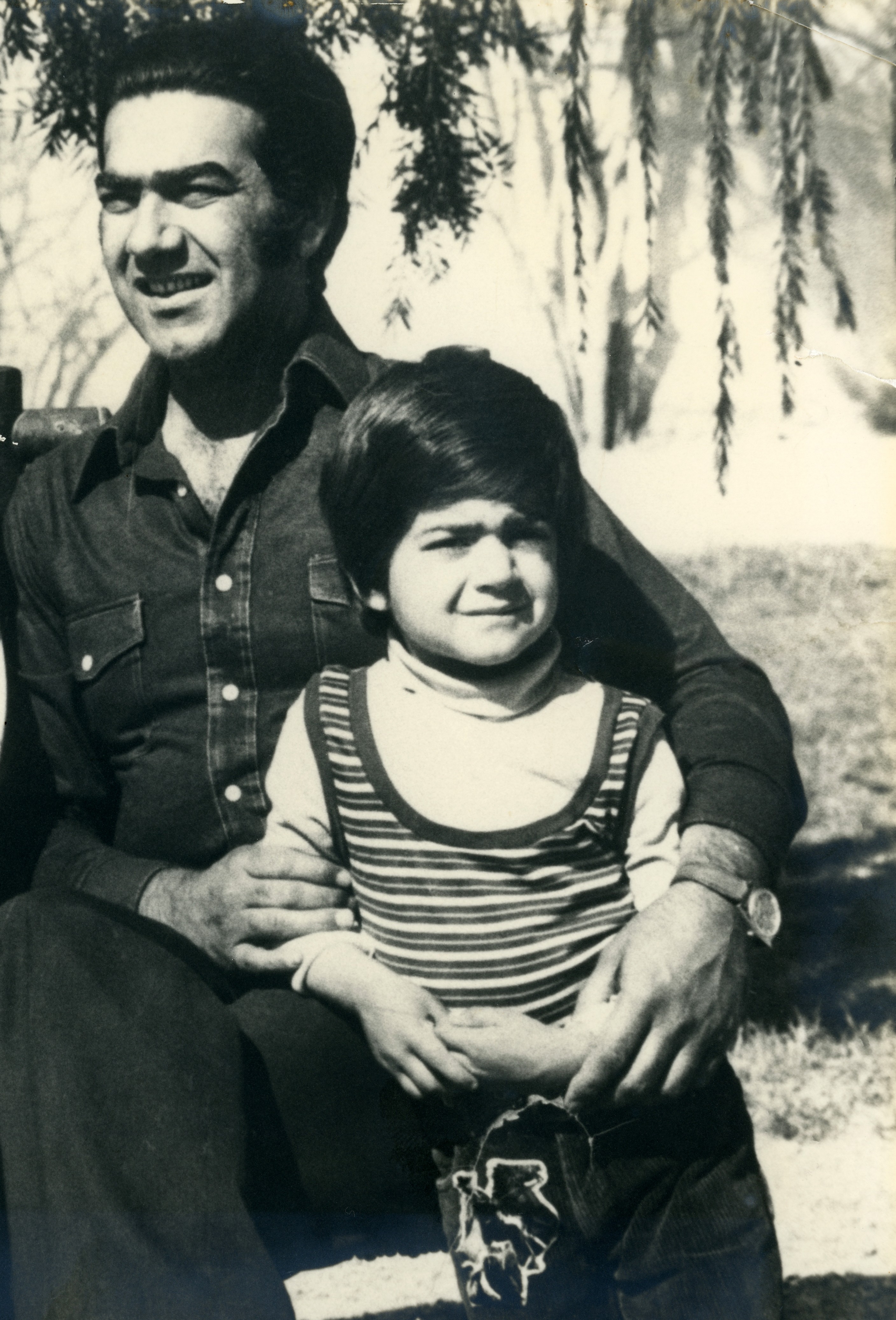 Mohammad Arif Sherdel with his son